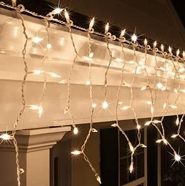 LED Indoor & Outdoor Snowing Icicle Chaser Lights with White Cable (960 Lights) - Warm White Lights